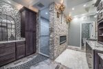BATHROOM 5 WITH VAVITY AREA, DOUBLE SINKS, DOUBLE SHOWER HEADS ON LOWER LEVEL & FIREPLACE